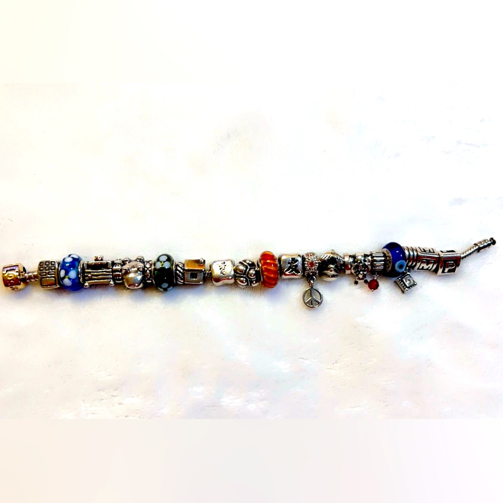 Pandora gold clasp & silver charm bracelet with retired princess & the pea charm